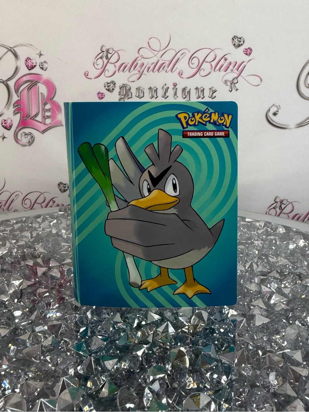 Pokemon trading card book Gray Duck Card Binder with Teal/Blue Swirl Background